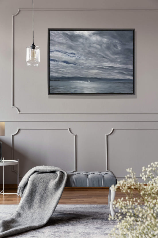 Original art, titled Yesterday, painted in oil on canvas, by Australian artist, Hayley Byron. The painting is a depiction of a ship sailing on the ocean at Burleigh Heads, in a rain storm. This image features the artwork in-situ in an interior living room