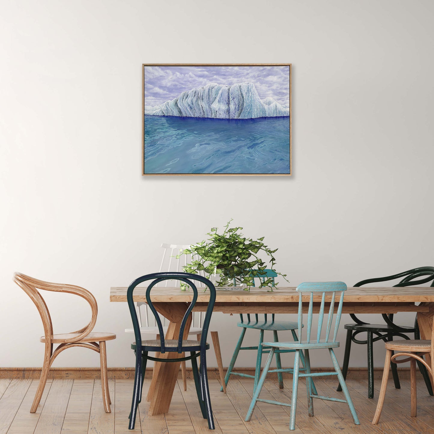 Original art, titled Ammonite, painted in oil on canvas, by Australian artist, Hayley Byron. The painting is a depiction of an iceberg, with clouds in the background, and water in the foreground. This image features the artwork in-situ, on a wall in an interior living room.