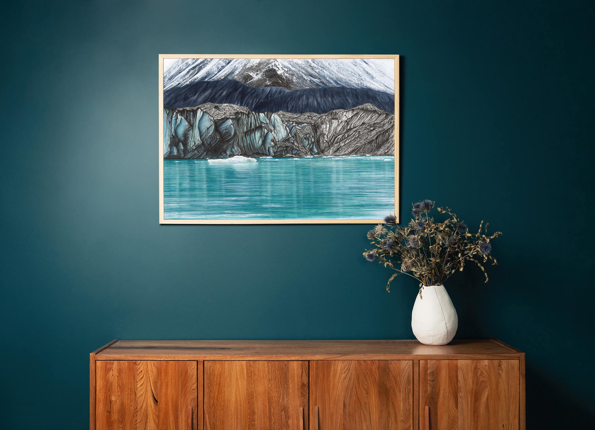 Original art, titled Fragment, by Australian artist, Hayley Byron, created in graphite, watercolour and gouache on fine art paper. The drawing is a depiction of the Tasman Glacier and icebergs. This image features the artwork in-situ, on a wall in an interior living room.